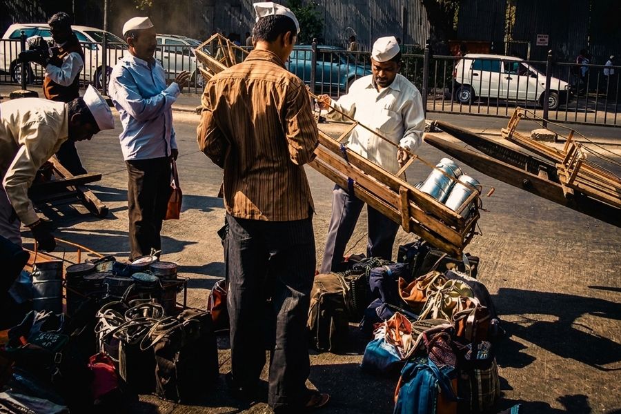 Mumbai Dabbawallas delivering lunches, India