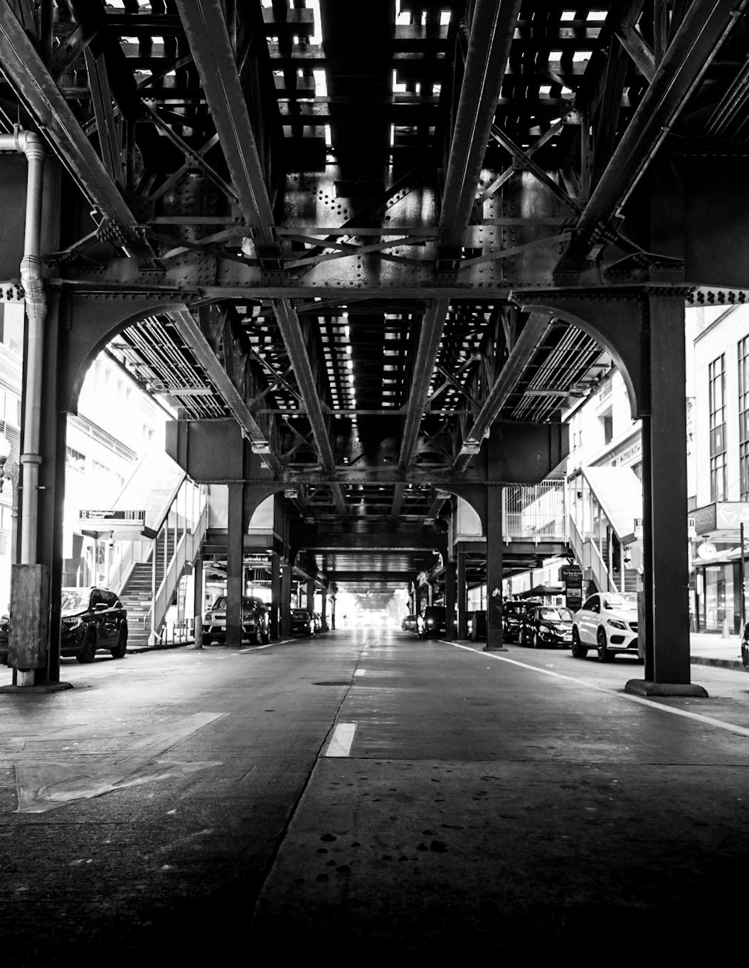 Chicago L elevated train tracks — cinematic B&W